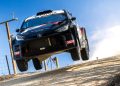 Lewis Bates flies through the air during a rally stage.